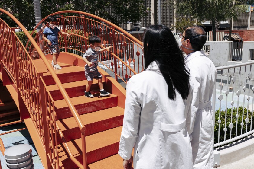 Children play on a bridge at Children's Hospital Los Angeles.
