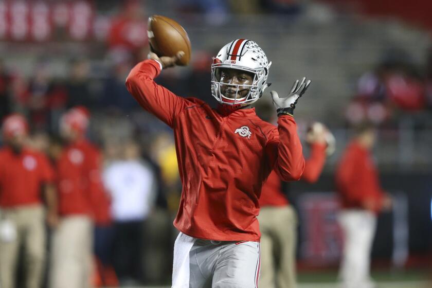 Ohio State quarterback J.T. Barrett throws a pass as the team warms up before a game against Rutgers on Oct. 24.