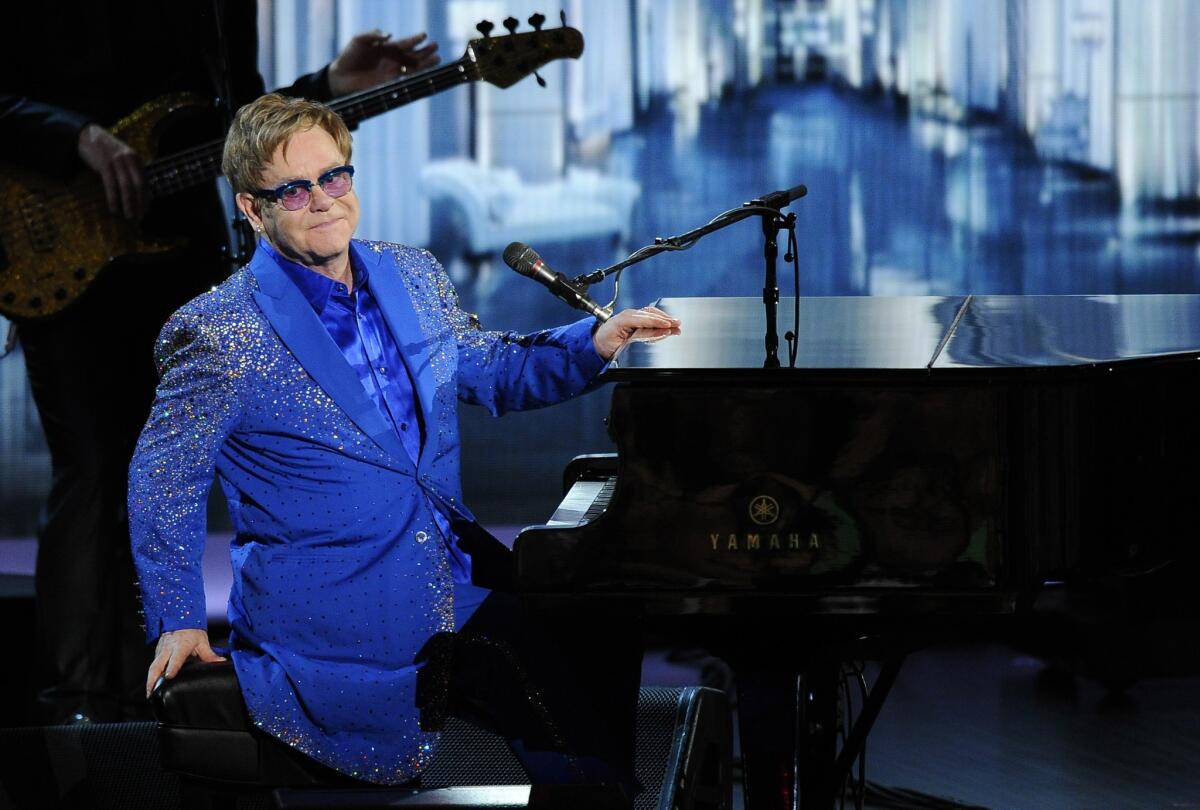 Elton John performs "Home Again" at the 65th Primetime Emmy Awards at the Nokia Theatre.