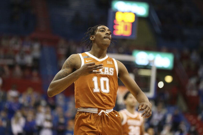 Texas guard Donovan Williams motions after scoring against Kansas in the second half of an NCAA college basketball game Saturday, Jan. 2. 2021, in Lawrence, Kan. (Evert Nelson/The Topeka Capital-Journal via AP)