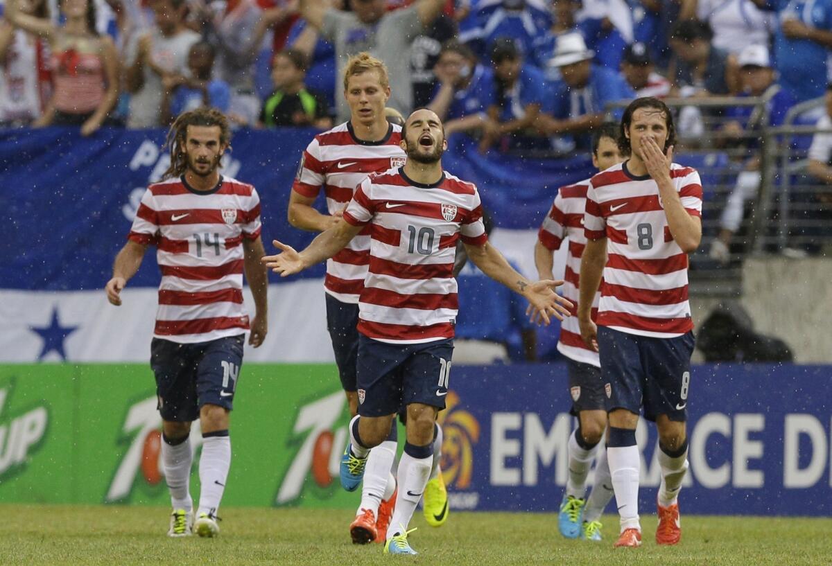 U.S. forward Landon Donovan, center, celebrates a goal against El Salvador in the CONCACAF Gold Cup tournament in July. The United States is hoping for a favorable World Cup draw Friday.