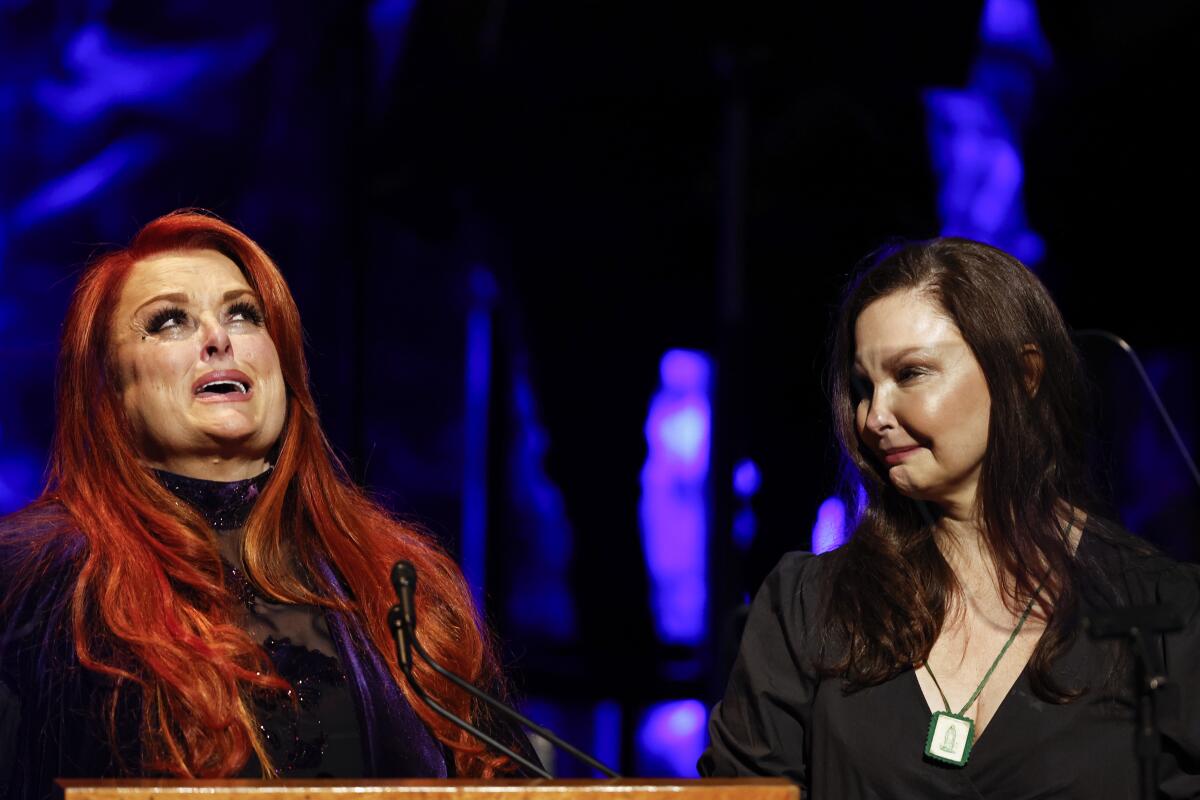 Two women get emotional onstage together