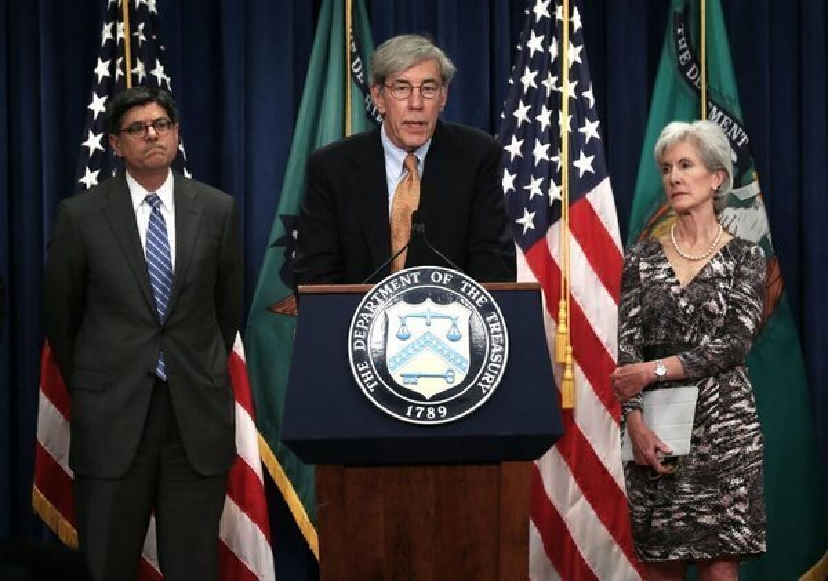 Social Security public trustee Robert Reischauer at Friday's news conference, flanked by Treasury Secretary Jacob Lew and Health and Human Services Secretary Kathleen Sebelius.