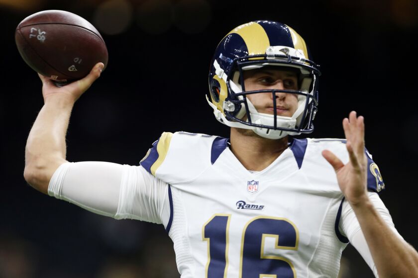 Rams quarterback Jared Goff (16) warms up before an NFL football game against the New Orleans Saints.