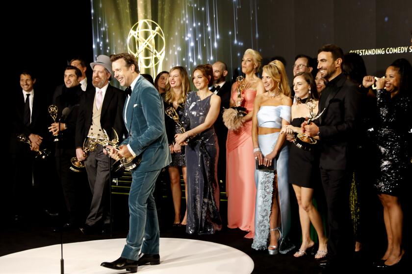 LOS ANGELES, CA - SEPTEMBER 19: Jason Sudeikis and the cast and crew of "Ted Lasso"with their awards in the virtual pressroom, for Outstanding Comedy Series award during the 73rd Annual Emmy Awards taking place at LA Live on/ Sunday, Sept. 19, 2021 in Los Angeles, CA. (Al Seib / Los Angeles Times)