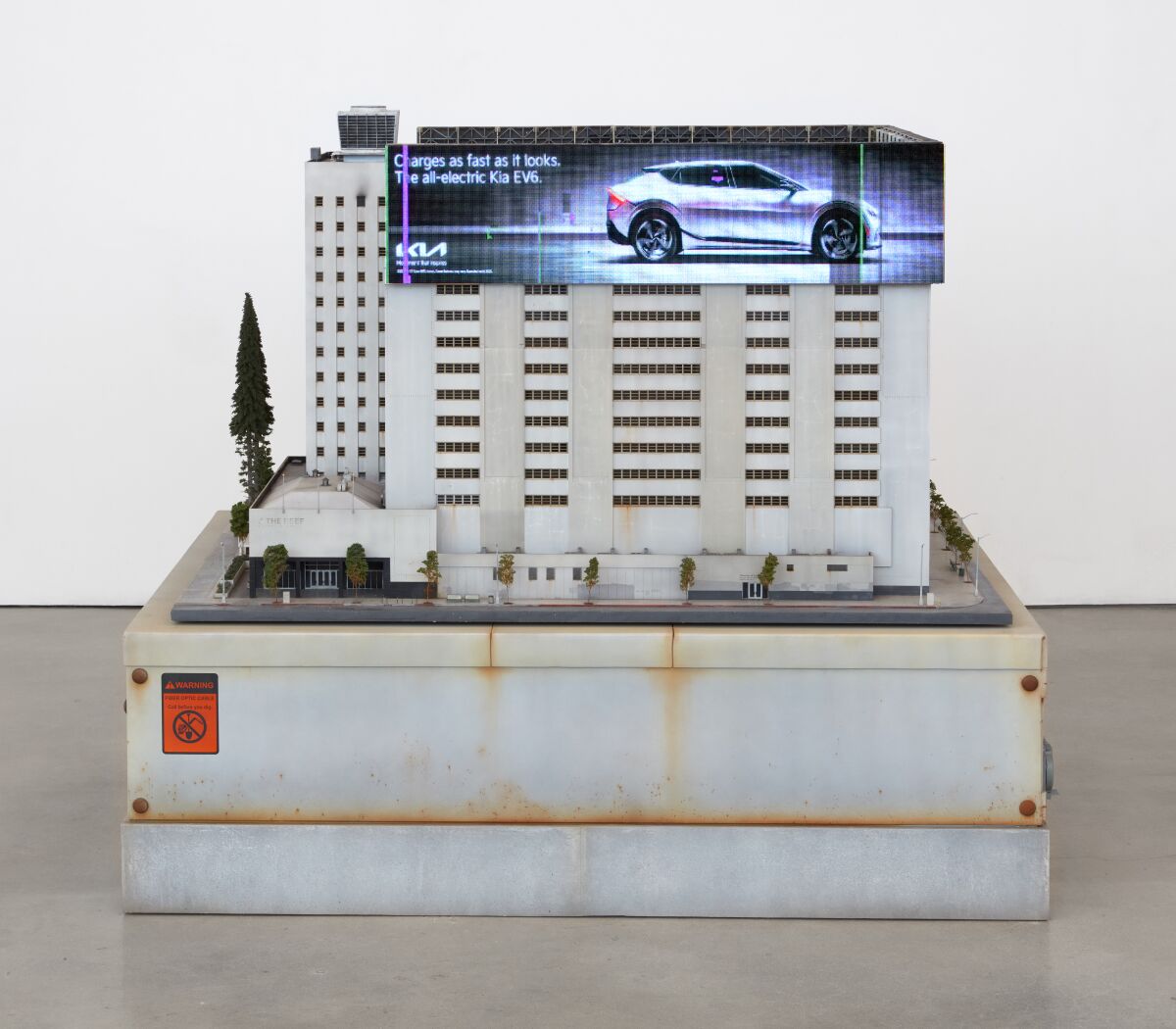 A miniatured re-creation of the industrial Reef building in downtown L.A., complete with LED billboard