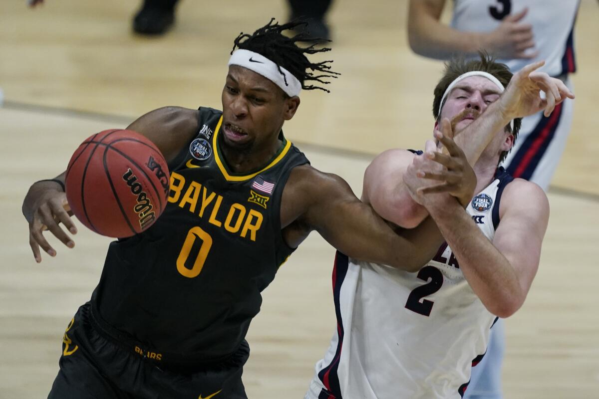 Flo Thamba of Baylor and Drew Timme of Gonzaga face off during an NCAA Men's basketball championship game