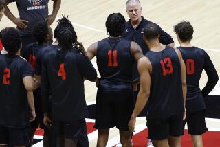 San Diego, CA, October 2, 2023: San Diego State basketball coach Brian Dutcher talks with his team during a practice at Viejas Arena on Monday, October 2, 2023. (K.C. Alfred / The San Diego Union-Tribune)