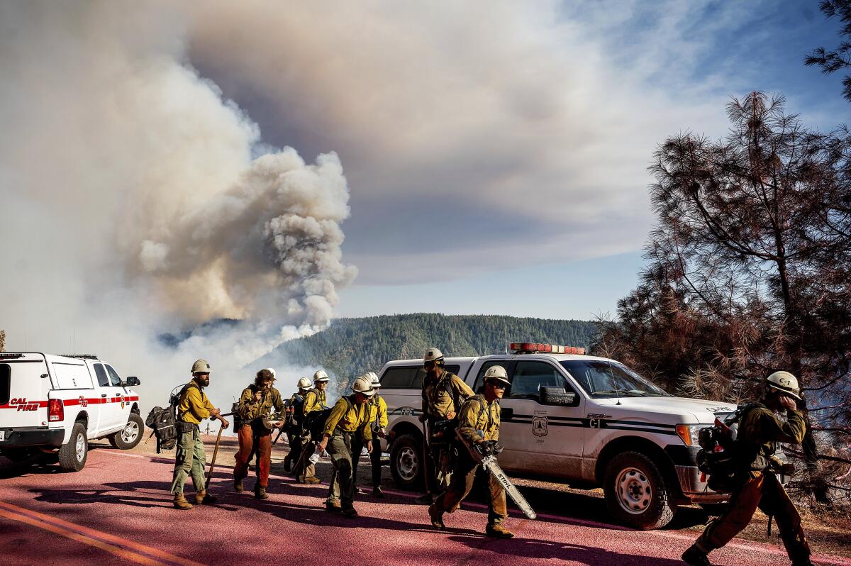 A hand crew prepares to battle the Mosquito Fire.