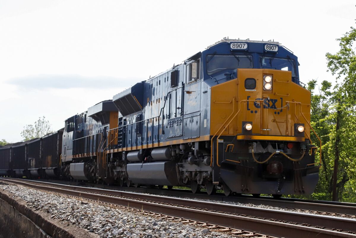 FILE - A CSX freight train pulls through McKeesport, Pa., on Tuesday, June 2, 2020. CSX has agreed, Tuesday, April 19, 2022, to start paying some of its employees more in advance of raises the railroad expects to agree to as part of ongoing national contract talks. (AP Photo/Gene J. Puskar)