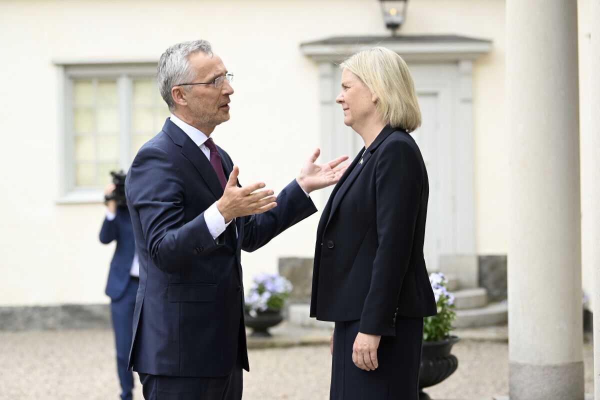 Sweden's Prime Minister Magdalena Andersson, right, welcomes NATO Secretary General Jens Stoltenberg at Harpsund, the country retreat of Swedish prime ministers, in Sodermanland County, Sweden, Monday, June 13, 2022. (Henrik Montgomery/TT News Agency via AP)