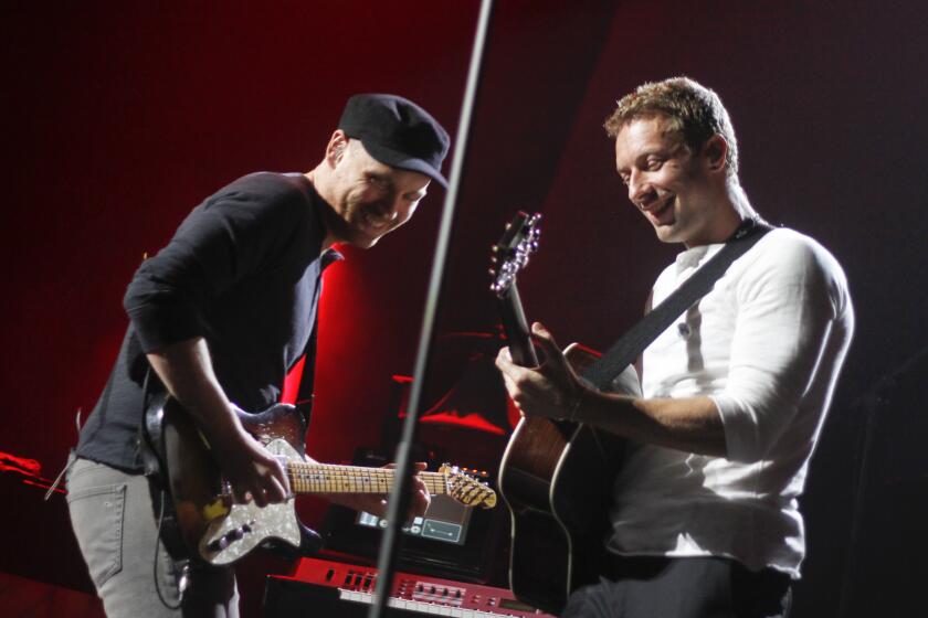 Coldplay's Jonny Buckland, left, and Chris Martin, shown performing in March in Austin, and the rest of the group will play May 19 at UCLA's Royce Hall in conjunction with the worldwide release that day of the band's new album "Ghost Stories."
