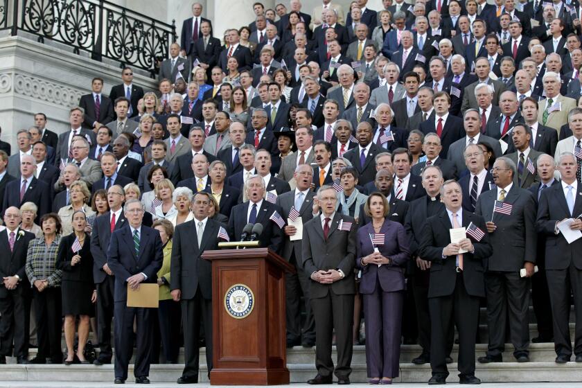 Members of Congress sing God Bless America on the steps of the Capitol in remembrance of the terror attacks of 2001, in Washington, Monday, Sept. 12, 2011. On bottom row from left are Senate Republican leader Mitch McConnell of Kentucky, House Speaker John Boehner, R-Ohio, and Senate Majority Leader Harry Reid, D-Nev. and House Minority Leader Nancy Pelosi, D-Calif. (AP Photo/J. Scott Applewhite)