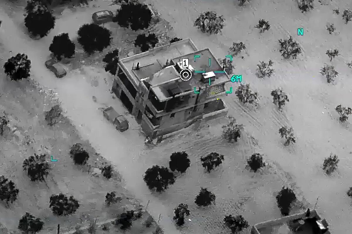 An aerial view of a building with a computer-generated target superimposed