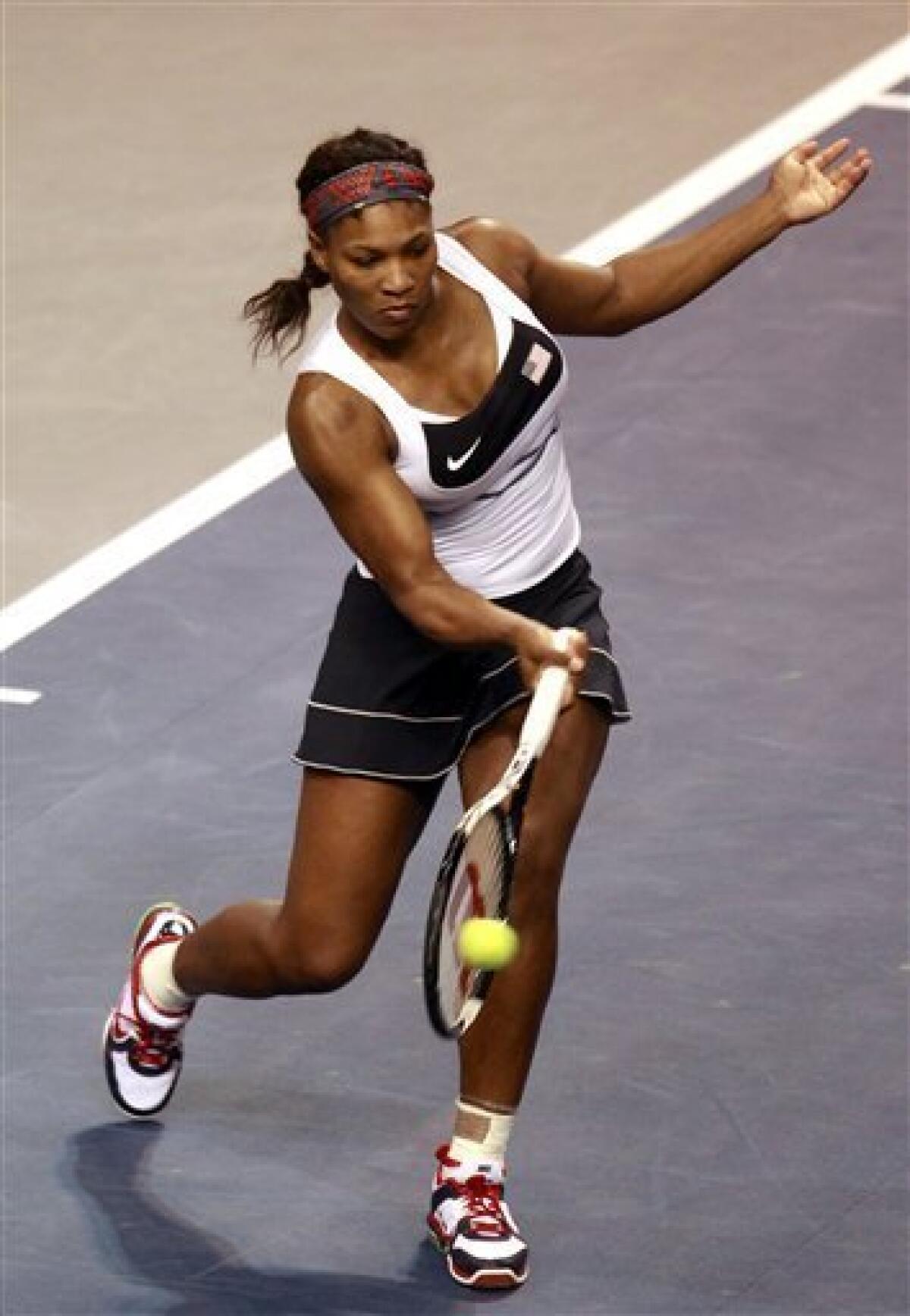 Serena Williams returns a ball to Anastasia Yakimova, of Belarus, during a first-round Fed Cup tennis match in Worcester, Mass., Sunday, Feb. 5, 2012. (AP Photo/Steven Senne)