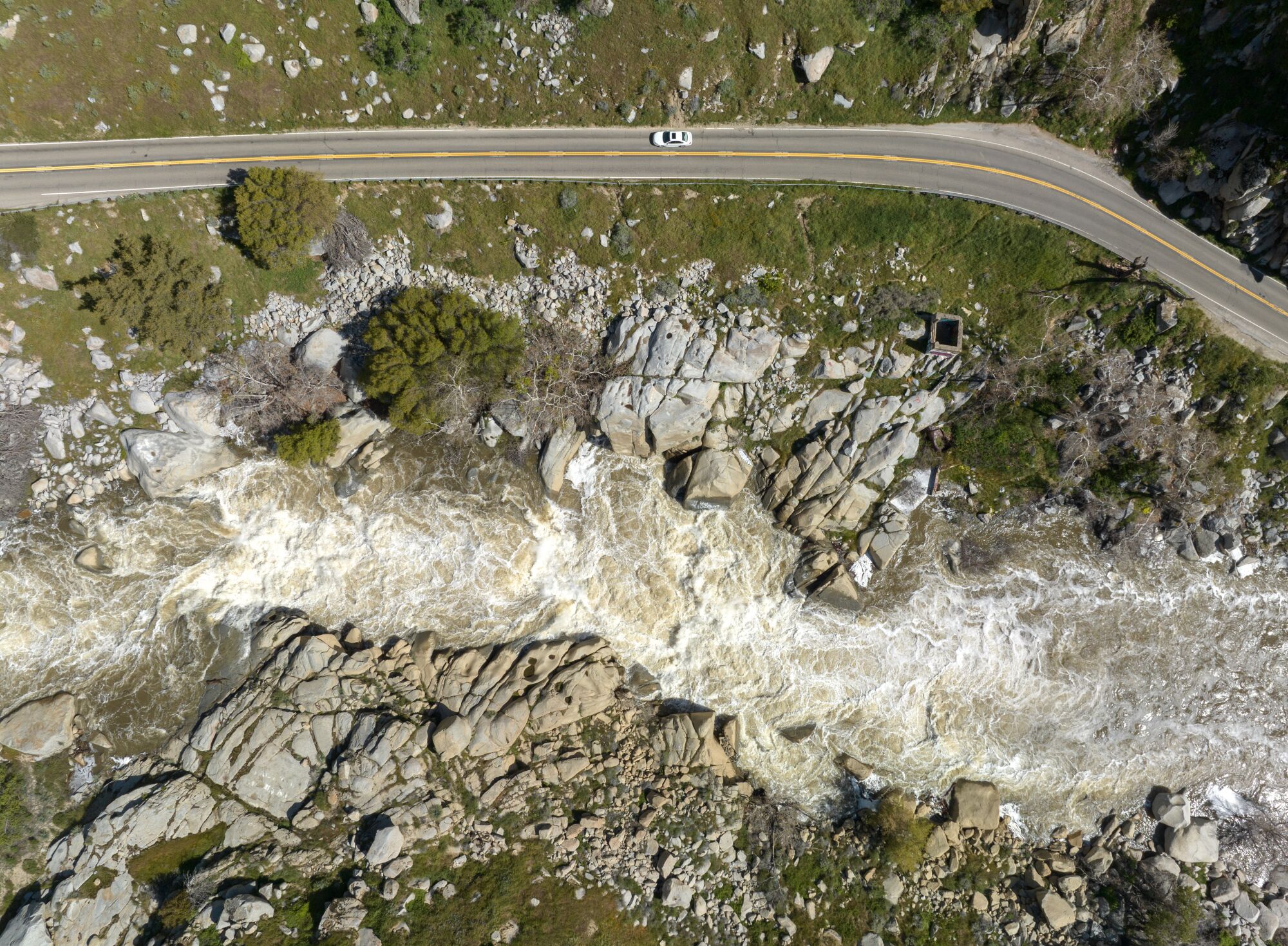 The lower Kern River surges with runoff from a recent series of powerful storms. 