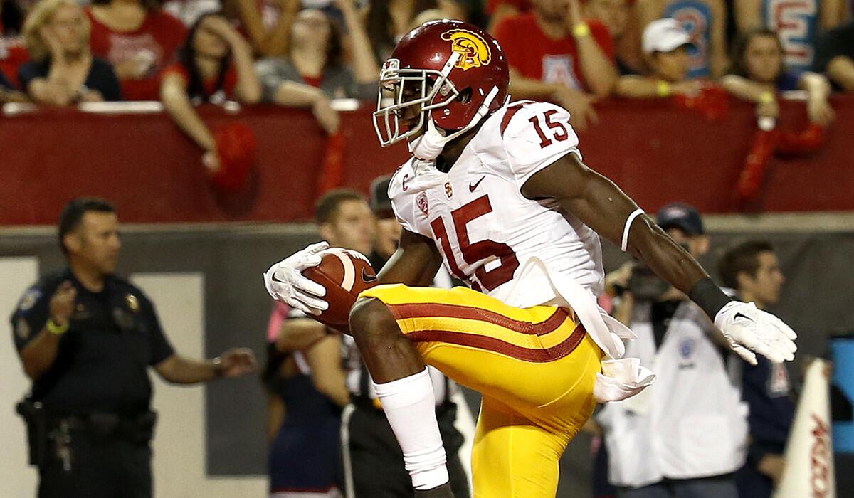 Wide receiver Nelson Agholor, high-stepping into the end zone against Arizona last week, is among a number of Trojans who could consider making themselves eligible for the NFL draft next spring.