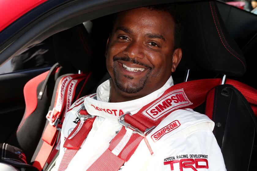 Alfonso Ribeiro waits for the start of a practice session at the Grand Prix of Long Beach.