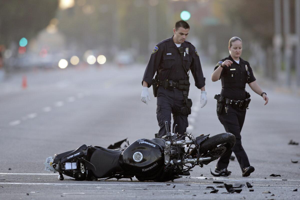 Police investigate a fatal hit-and-run incident in Downey in 2010. A new study says fatal motorcycle accidents were down 7% nationally in 2013, and down 13% in California.