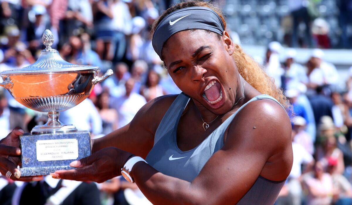 Serena Williams celebrates after receiving the winner's trophy at the Italian Open on Sunday in Rome.