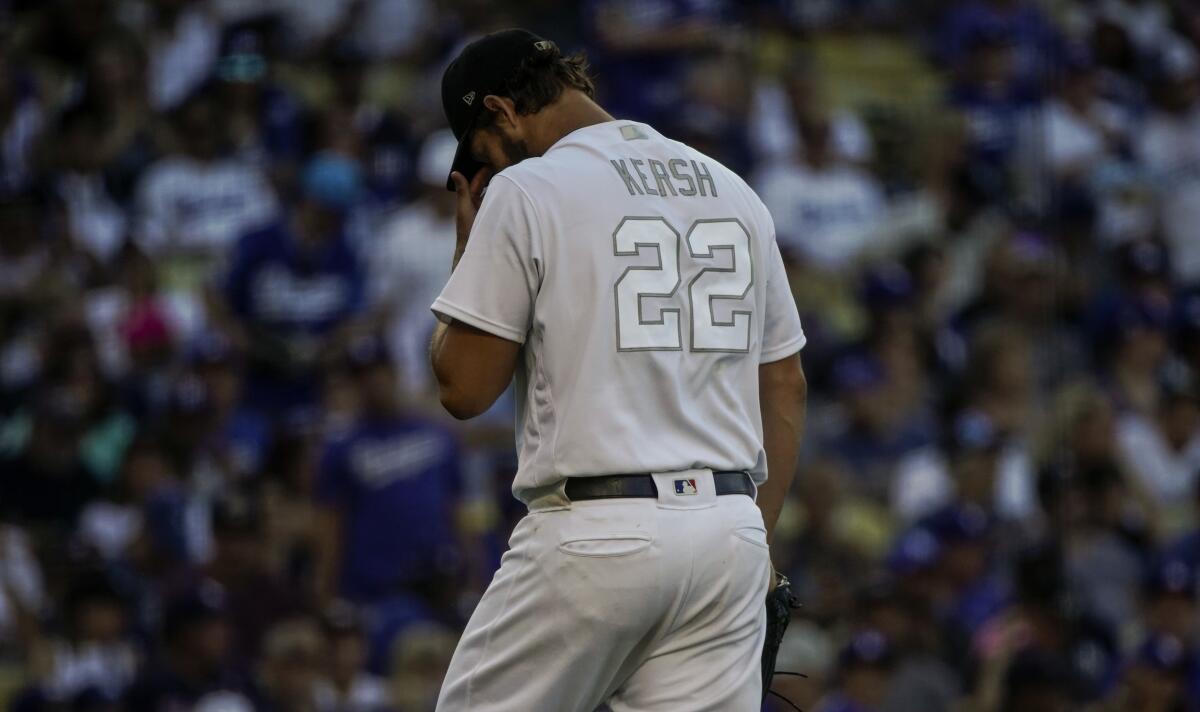 Dodgers starter Clayton Kershaw walks to the dugout during Sunday's 5-1 loss to the New York Yankees.