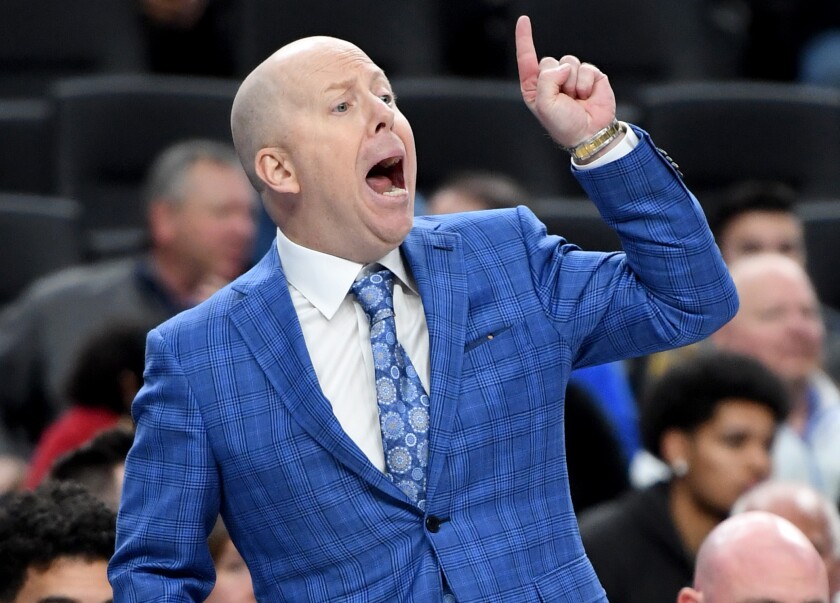UCLA coach Mick Cronin gestures during a game against North Carolina.