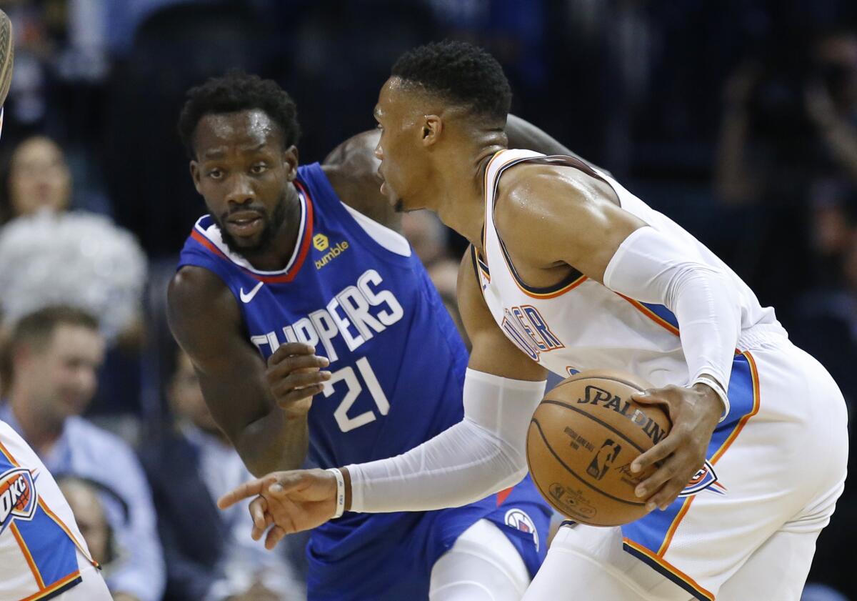 Thunder guard Russell Westbrook tries to drive against Clippers guard Patrick Beverley during a game in 2018.