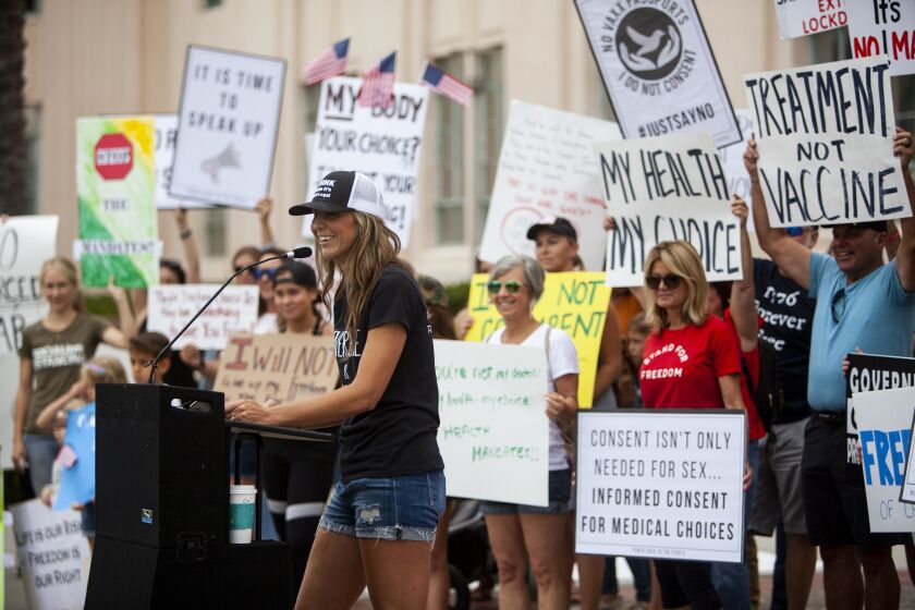 San Diego, CA - August 17: ReOpen San Diego demonstrators protest COVID-19 restrictions at the San Diego County Administration Building, in San Diego, CA. {({photographer} / The San Diego Union-Tribune)