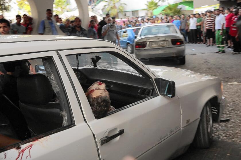 Wounded Palestinians are taken to a hospital after an airstrike on a market in Gaza City's Shajaiya area, on a day of heavy Israeli bombardment in the Gaza Strip.