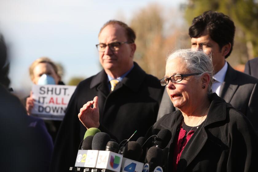 State Senators Fran Pavley, center, Bob Huff, left, and Kevin De Leon, right, hold a press conference outside Southern California Gas Co.'s Aliso Canyon gate in Porter Ranch on Monday morning, where they announced a state Senate legislative bill package connected to the continuing gas leak.