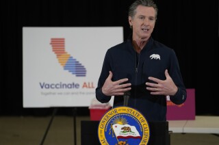 California Gov. Gavin Newsom takes question from the media at the Baldwin Hills Crenshaw Plaza in Los Angeles Thursday, April 1, 2021. California Gov. Gavin Newsom received his "one and done" Johnson & Johnson coronavirus vaccine Thursday, as people 50 and older became eligible for the coveted inoculations in the most populous state in the country. The state of nearly 40 million residents is coming back to life as more business sectors reopen following a crushing winter surge. (AP Photo/Damian Dovarganes)