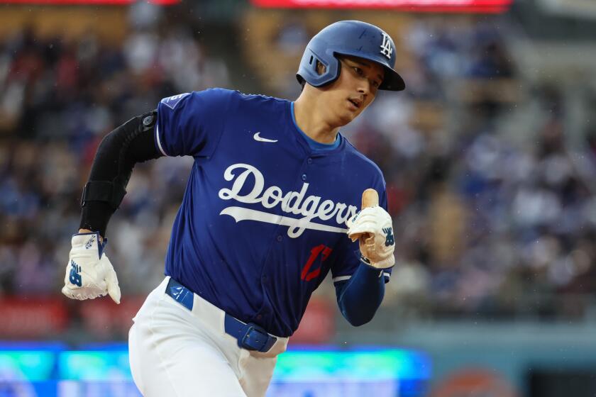 Los Angeles, CA - March 24: Los Angeles Dodgers designated hitter Shohei Ohtani (17) runs the bases.