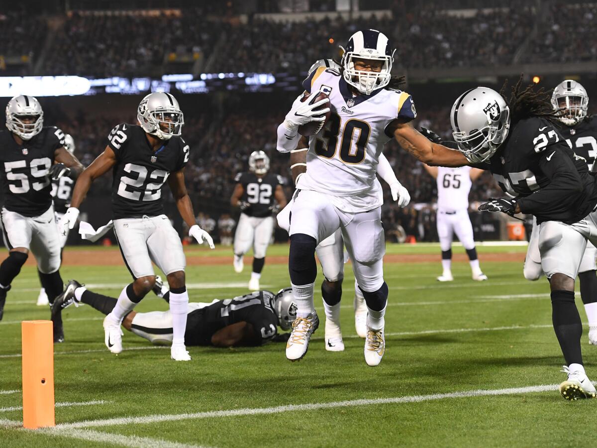 Los Angeles Rams running back Todd Gurley beats the Oakland Raider defense to the end zone in the first quarter at Oakland Coliseum.