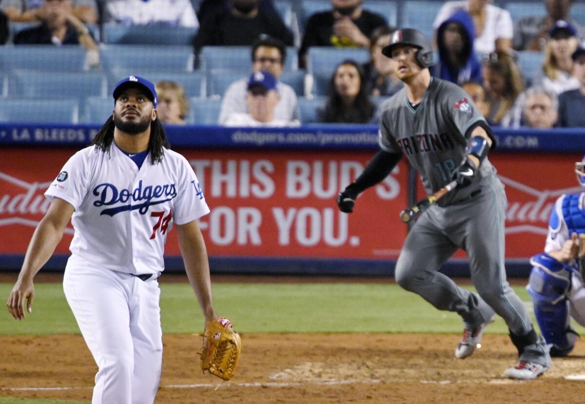 Dodgers closer Kenley Jansen watches Carson Kelly's game-tying two-run homer Friday night. 