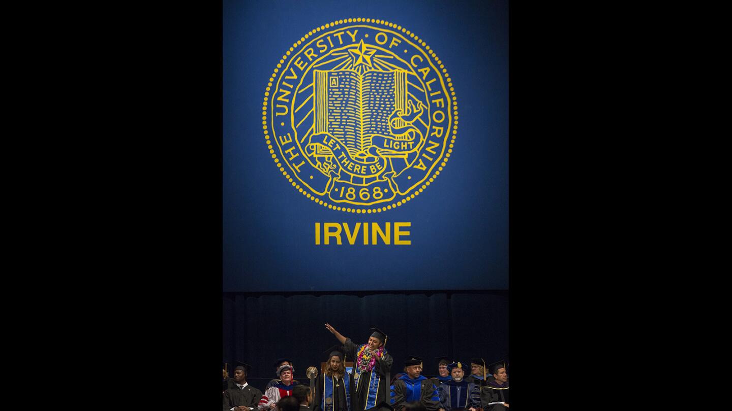 A graduate dabs during the 2017 commencement ceremony for the School of Social Ecology at UC Irvine on Friday, June 16.