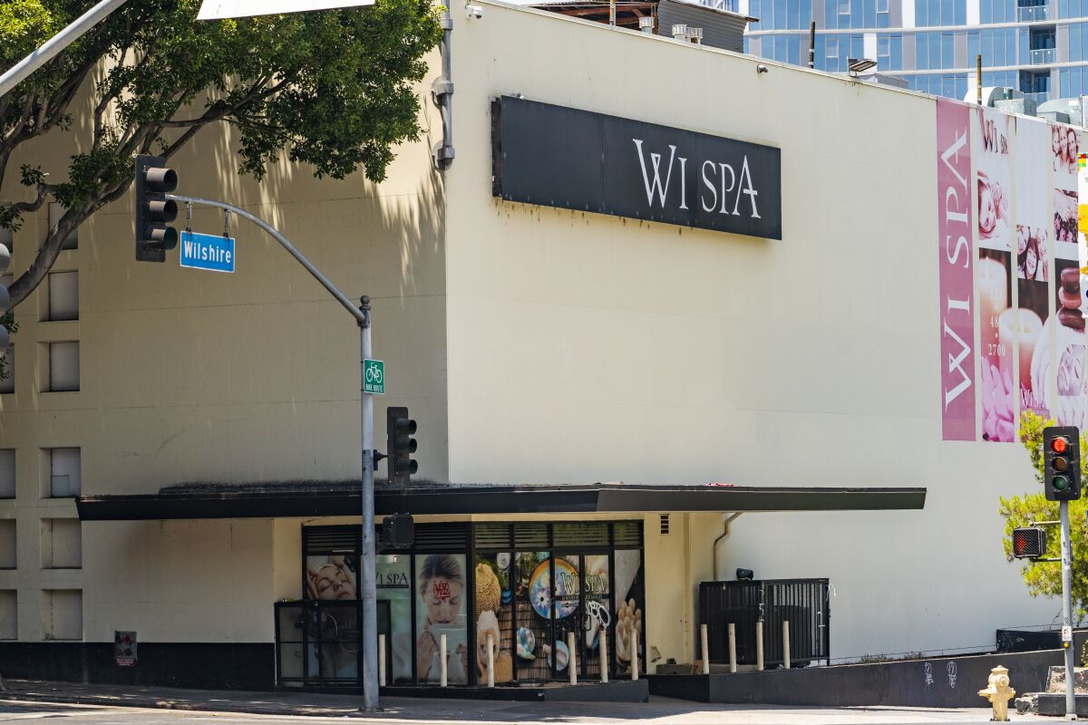 This July 4, 2021, photo, shows the exterior of the Wi Spa in Koreatown district in Los Angeles. Police declared an unlawful assembly and fired non-lethal projectiles to disperse an unruly crowd on Saturday, July 17, after a dueling protest over transgender rights at the Los Angeles spa turned violent. The protests stemmed from a video that circulated online earlier this month, in which an irate customer complained to the staff at Wi Spa that a transgender woman was in the women's section of the spa. (AP Photo/Damian Dovarganes)