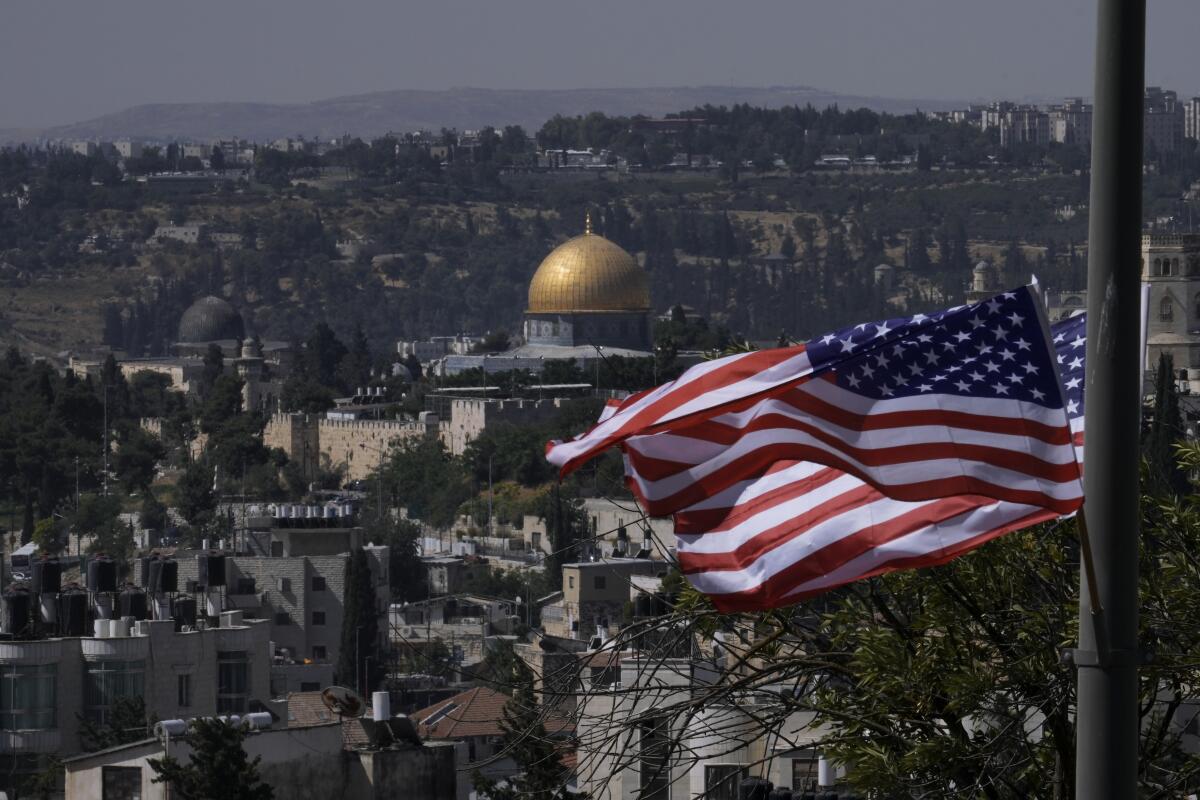 With the Dome of the Rock shrine in the background, U.S. flags fly ahead of a visit by President Joe Biden, in Jerusalem, Tuesday, July 12, 2022. Biden arrives to Israel on Wednesday for a three-day visit, his first as president. He will meet Israeli and Palestinian leaders before continuing to Saudi Arabia. (AP Photo/Mahmoud Illean)