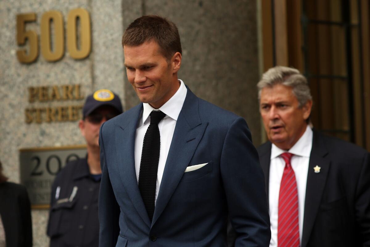 New England quarterback Tom Brady leaves federal court in New York City on Monday.