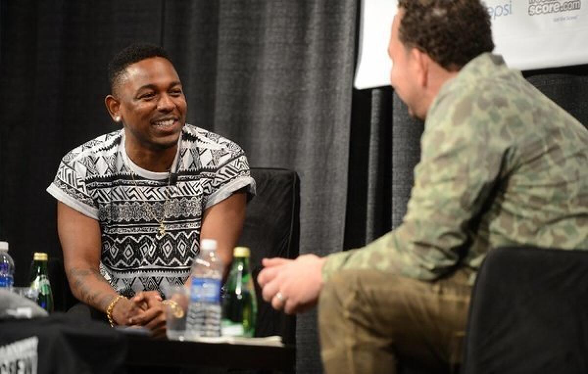 Rapper Kendrick Lamar, left, in conversation with Jessie Wright at the 2013 South by Southwest festival in Austin, Texas. Lamar appeared in an official showcase at Austin Music Hall on Friday.