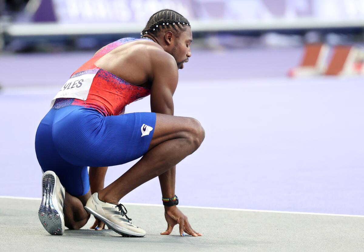 American sprinter Noah Lyles catches his breath after the 200-meter final at the 2024 Paris Olympics Thursday. 