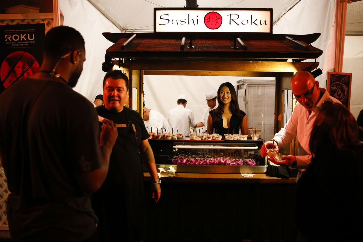 Dishes from Sushi Roku is served during opening night of the Los Angeles Times' The Taste event at the Paramount Studios backlot on Sept. 4. The Hollywood location of the sushi restaurant will close Oct. 17.