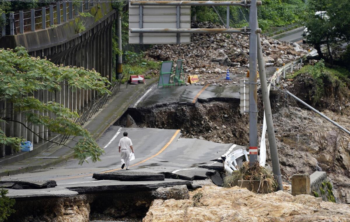 A flood-damaged road in Kumamura, Japan, on Monday.