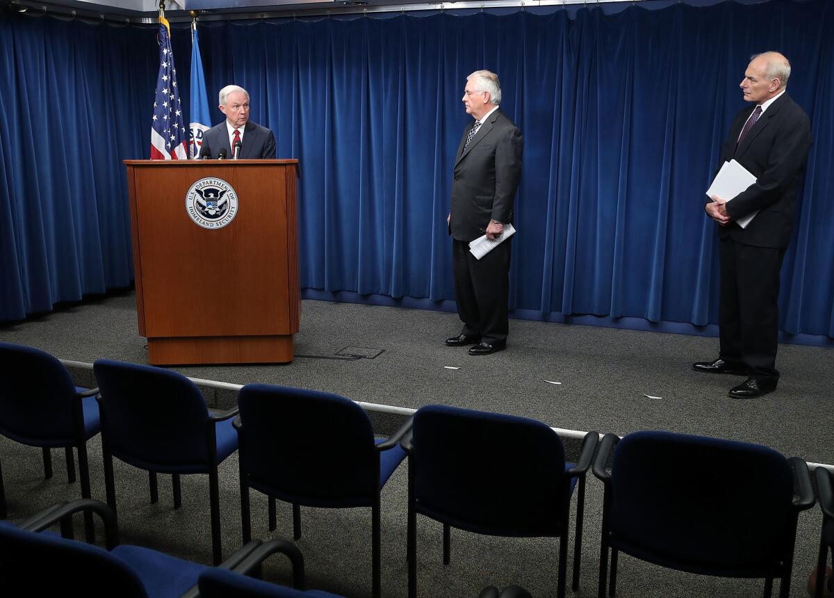 Atty. Gen. Jeff Sessions, left, speaks alongside Secretary of State Rex Tillerson, center, and Homeland Security Secretary John F. Kelly on Monday in Washington.