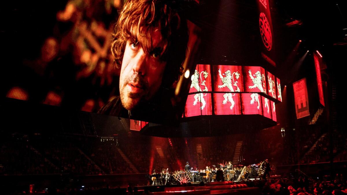 Screens project "Game of Thrones" character Tyrion Lannister (Peter Dinklage) to music during the Game of Thrones Live Concert Experience performance led by composer Ramin Djawadi at the Forum in Inglewood. (Patrick T. Fallon / For The Times)