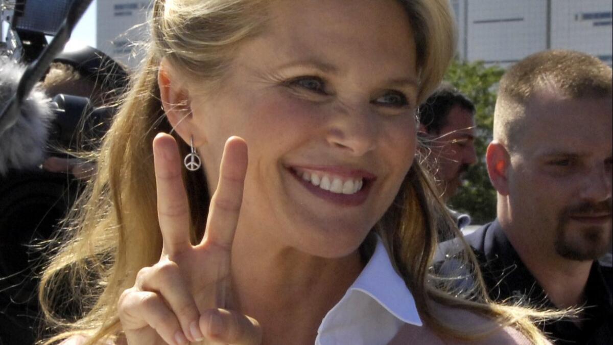 Christie Brinkley flashes a victory sign outside court after reaching a settlement in her divorce from Peter Cook in 2008. In a survey of recently divorced or widowed women, 59% said they regretted not taking part in long-term financial planning when they were in a couple.