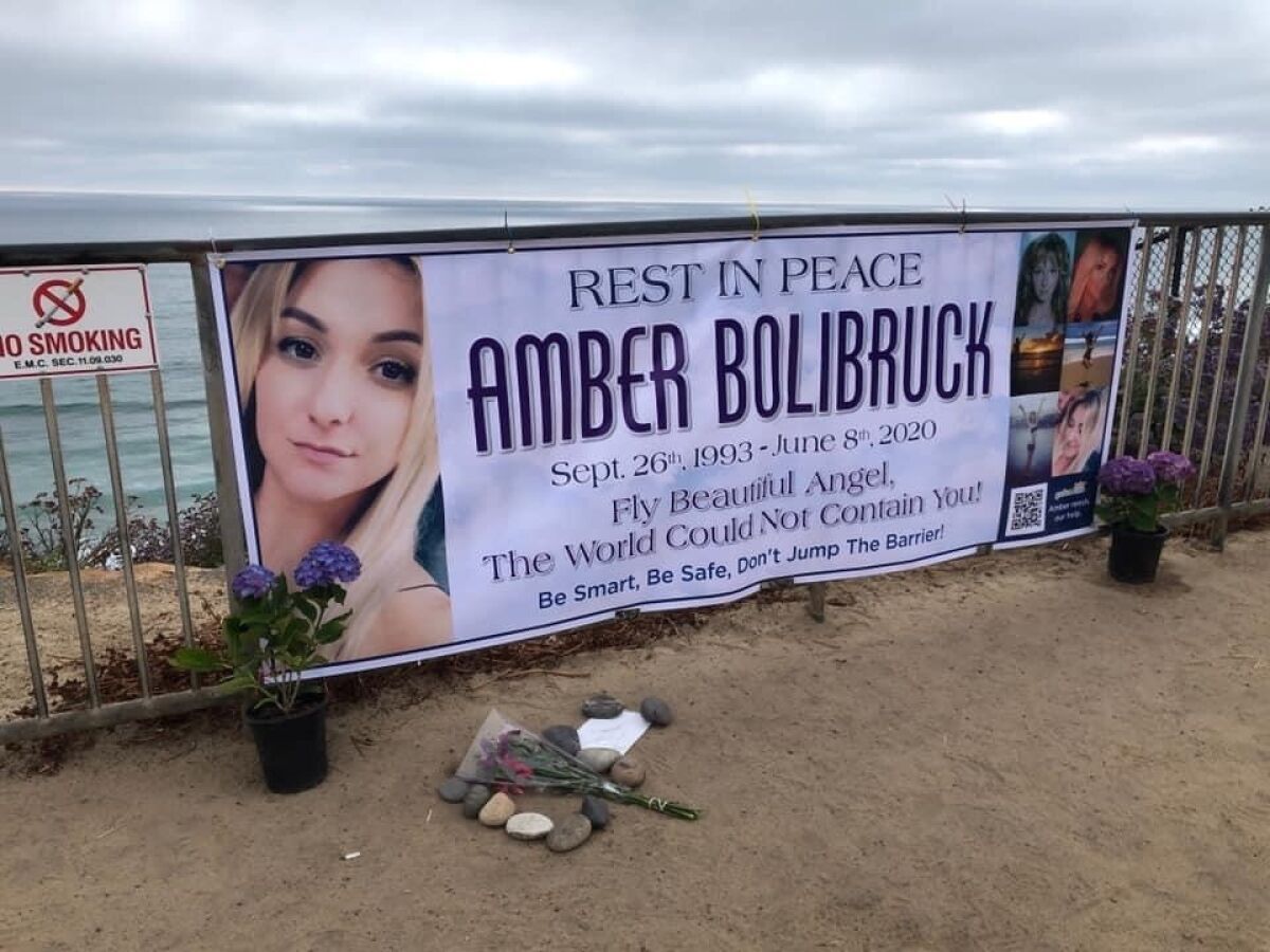 This banner hangs above Moonlight Beach. Bolibruck apparently jumped over this barrier before suffering a fatal fall June 3.