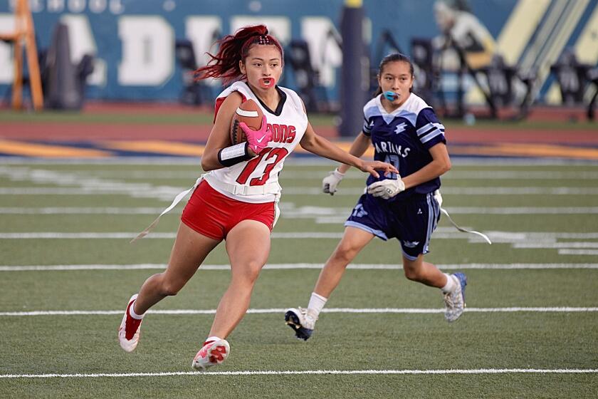 Julianna Sarabia of Verdugo Hills scores a touchdown in the first half of Saturday’s City Division I flag football final.