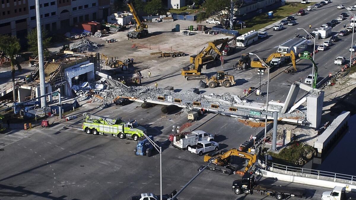 Recovery operations continue at the site of the collapsed pedestrian bridge near Florida International University in Miami on March 17, 2018.