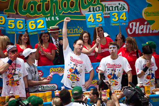 Joey Chestnut celebrates his victory at the 2011 Nathan's Famous Fourth of July International Hot Dog Eating Contest.