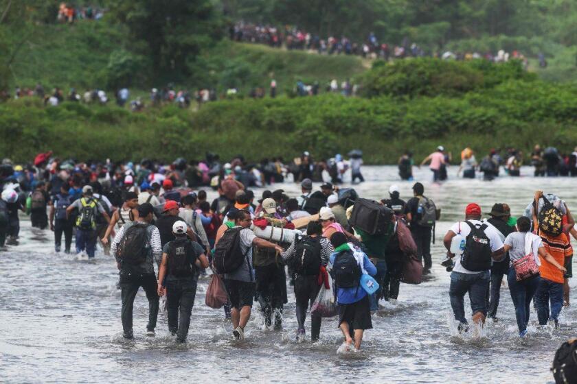 Salvadorean migrants heading in a caravan to the US, cross the Suchiate River to Mexico, as seen from Ciudad Tecun Uman, Guatemala, on November 02, 2018. - According to the Salvadorean General Migration Directorate (DGME), over 1,700 Salvadoreans left the country in two caravans and entered Guatemala Wednesday, in an attempt to reach the US. (Photo by MARVIN RECINOS / AFP)MARVIN RECINOS/AFP/Getty Images ** OUTS - ELSENT, FPG, CM - OUTS * NM, PH, VA if sourced by CT, LA or MoD **